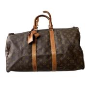 Pre-owned Brunt lerret Louis Vuitton Keepall